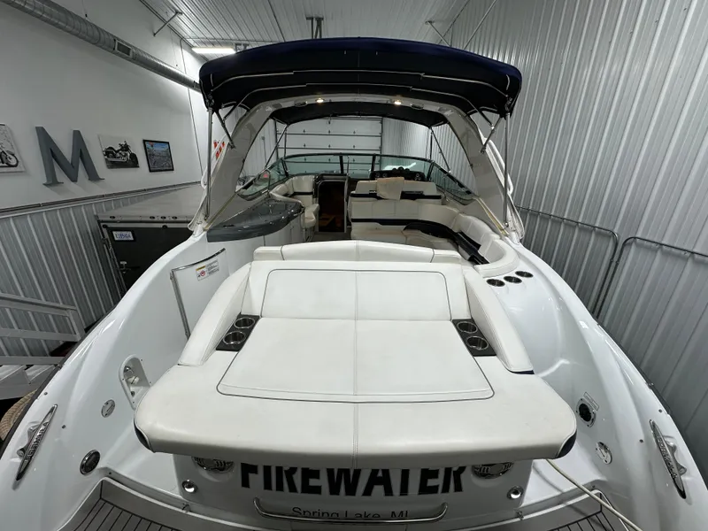Slide: The Image of 2014 Formula 370 Super Sport boat in storage, featuring spacious seating and sleek design. - 2