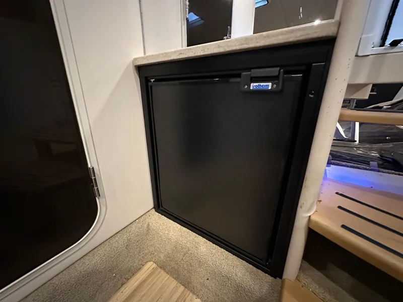 Slide: The Image of Compact refrigerator in 2014 Formula 370 Super Sport boat interior. - 21