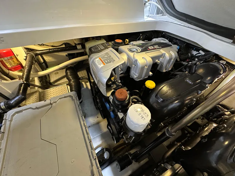 Slide: The Image of Engine compartment of a 2014 Formula 370 Super Sport boat, showcasing detailed components. - 27