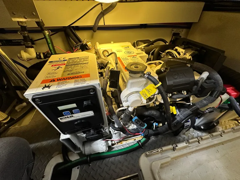 Slide: The Image of Engine compartment of a 2014 Formula 370 Super Sport boat, featuring detailed machinery. - 29