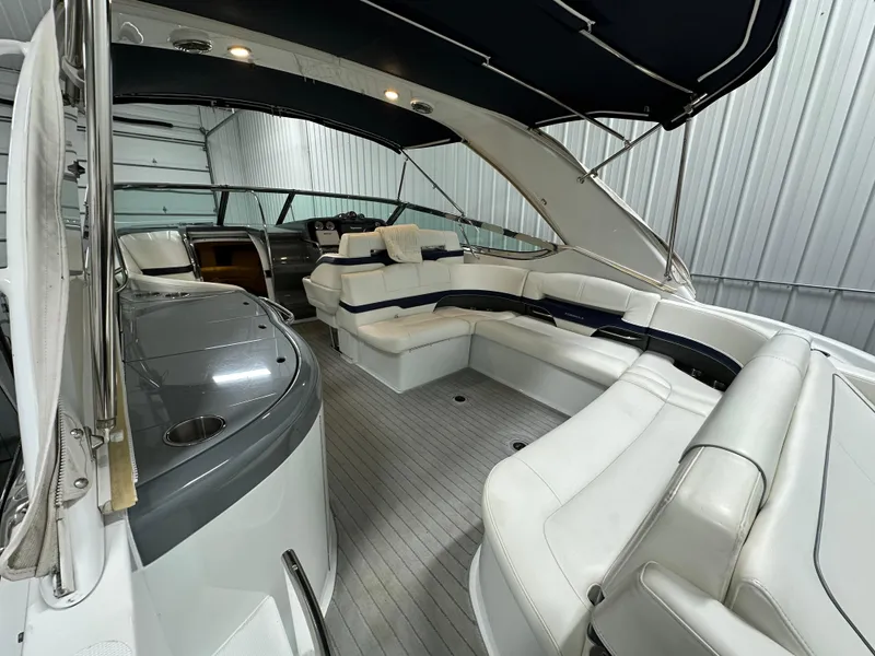 Slide: The Image of 2014 Formula 370 Super Sport boat interior with white seating and sleek design. - 3
