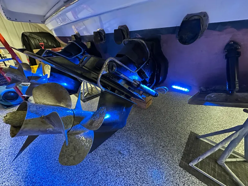 Slide: The Image of 2014 Formula 370 Super Sport boat propellers with blue LED lighting in a garage setting. - 32