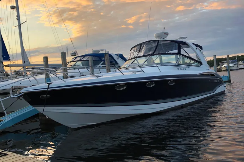 Slide: The Image of 2014 Formula 370 Super Sport boat docked at sunset. - 33