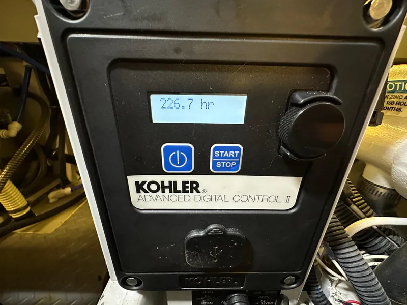 Slide: The Image of Kohler digital control panel displaying 226.7 hours on a 2014 Formula 370 Super Sport. - 35