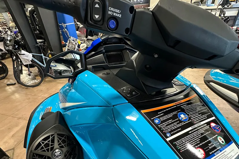 Slide: The Image of 2025 Yamaha WaveRunner VX Deluxe in showroom, featuring control panel and vibrant blue design. - 4