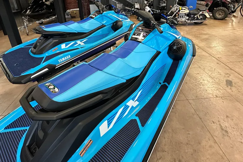 Slide: The Image of 2025 Yamaha WaveRunner VX Deluxe in vibrant blue, displayed indoors. - 5