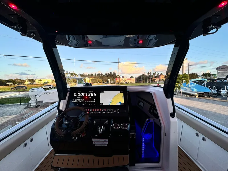 Slide: The Image of Interior view of 2025 Edgewater 370 CC boat with modern dashboard and navigation system. - 15