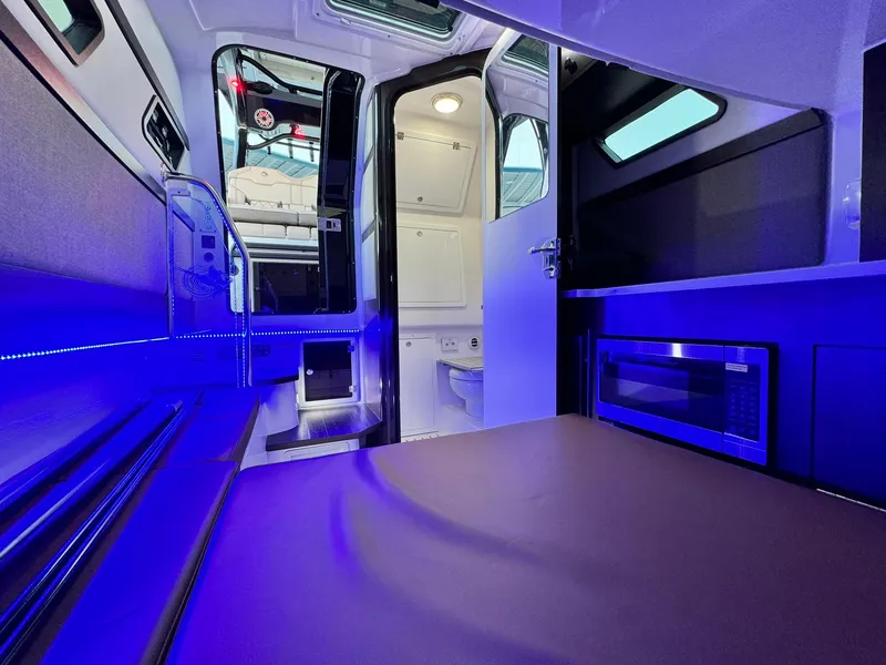 Slide: The Image of Interior of 2025 Edgewater 370 CC boat with modern lighting and amenities. - 20