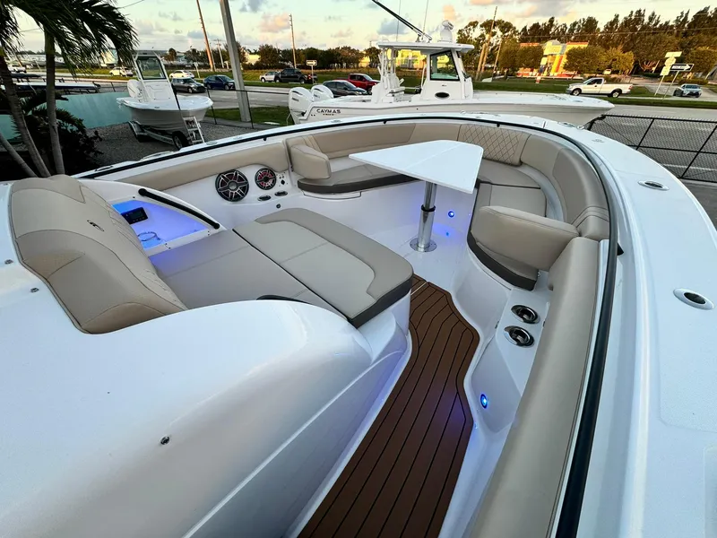 Slide: The Image of Luxurious 2025 Edgewater 370 CC boat interior with seating and table. - 25