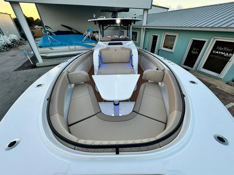 Slide: The Image of 2025 Edgewater 370 CC boat with spacious seating and modern design. - 28
