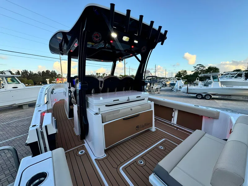 Slide: The Image of 2025 Edgewater 370 CC boat interior with sleek seating and modern design. - 6