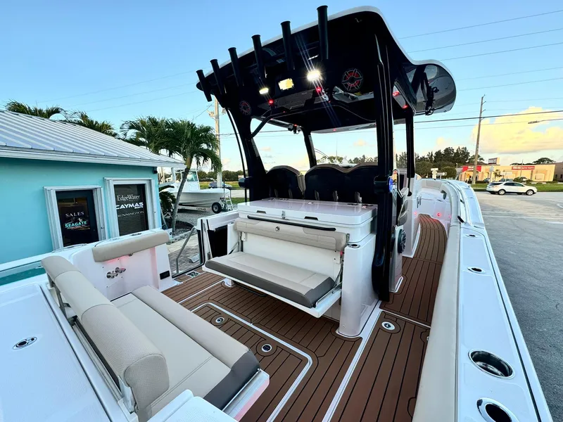 Slide: The Image of 2025 Edgewater 370 CC boat with sleek design and spacious seating. - 7