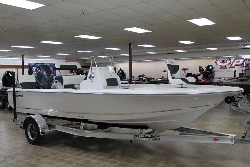 The Image of 2025 Tidewater 1910 BM boat on trailer in showroom. - 1