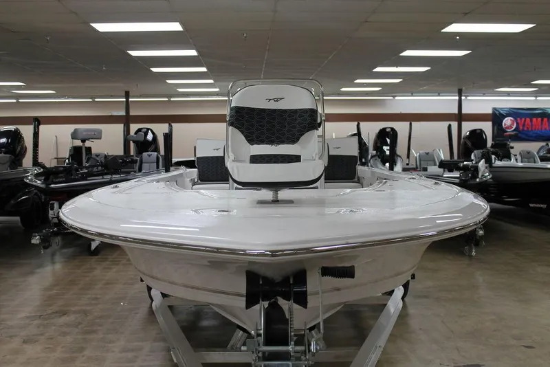 Slide: The Image of 2025 Tidewater 1910 BM boat displayed in showroom, front view. - 3