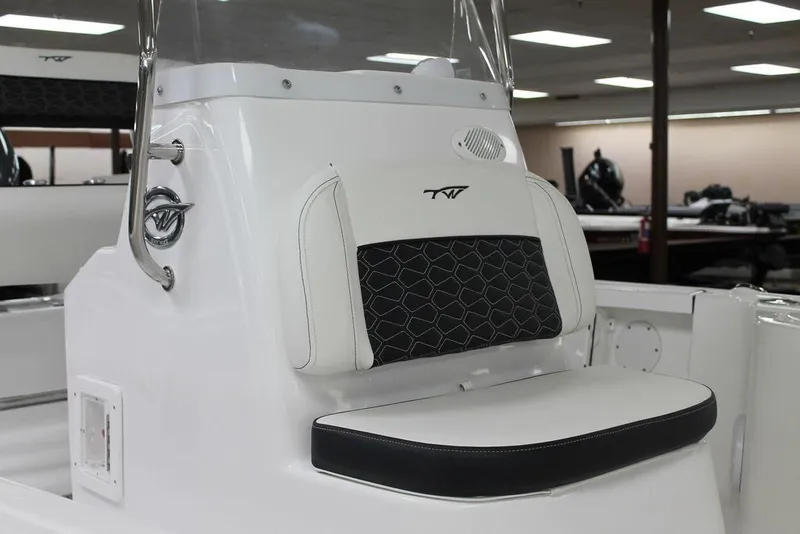 Slide: The Image of 2025 Tidewater 1910 BM boat interior with cushioned seating and sleek design. - 9