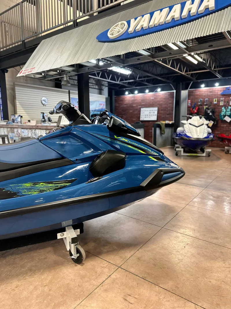 Slide: The Image of 2025 Yamaha WaveRunner VX Cruiser HO in showroom, blue color, side view. - 5