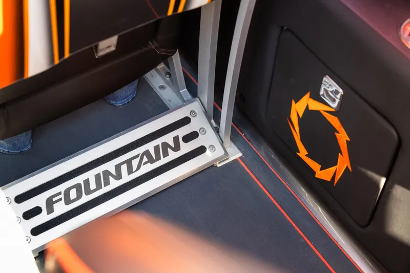 Slide: The Image of Fountain 47 Lightning 2020 boat interior with branded step and orange design. - 14