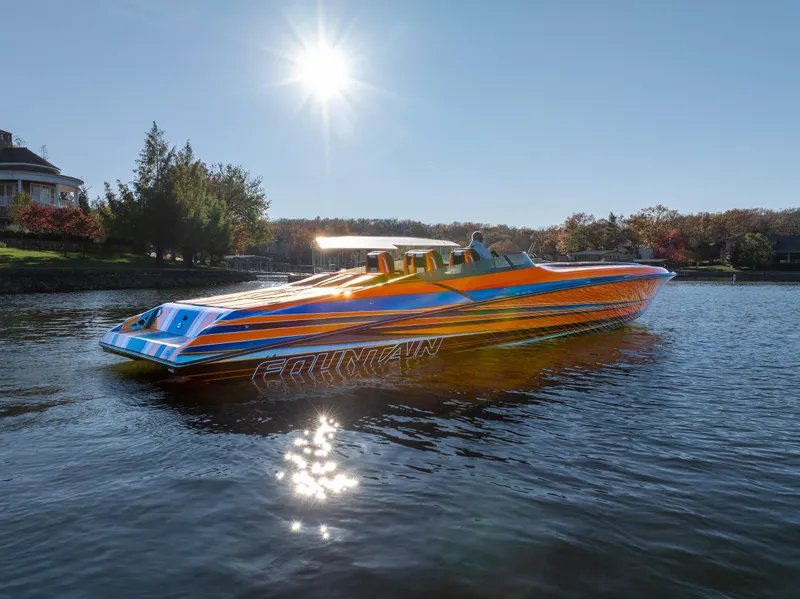 Slide: The Image of Vibrant 2020 Fountain 47 Lightning boat on a sunny lake. - 2
