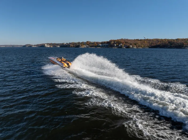 Slide: The Image of 2020 Fountain 47 Lightning speedboat creating a large wake on a sunny lake. - 8