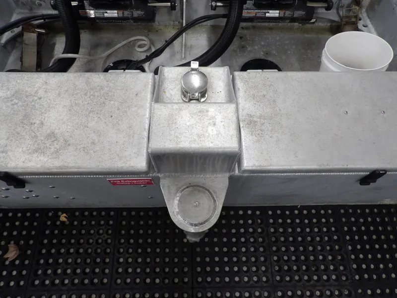 Slide: The Image of 2005 SAFE Boats Defender 25 interior, featuring metal components and wiring. - 29