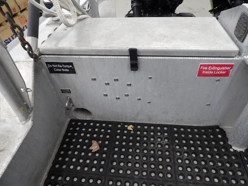 Slide: The Image of SAFE Boats Defender 25, 2005 model, interior with safety labels and non-slip flooring. - 31