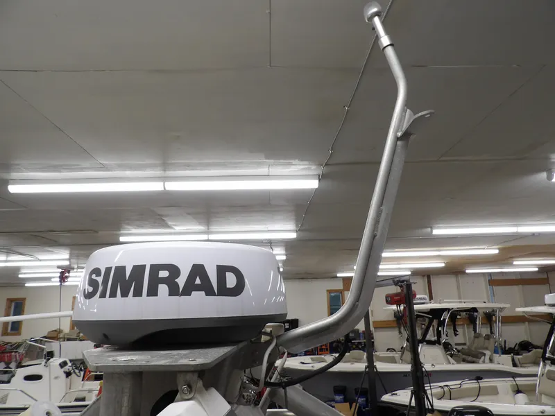Slide: The Image of Simrad radar on 2005 SAFE Boats Defender 25 in a garage setting. - 35