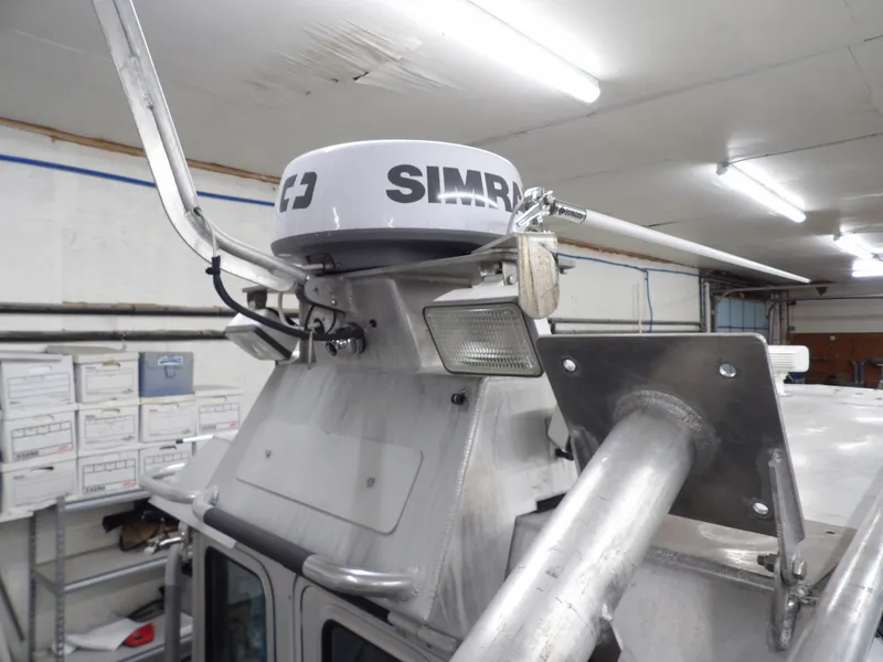 Slide: The Image of 2005 SAFE Boats Defender 25 radar equipment in a garage setting. - 36