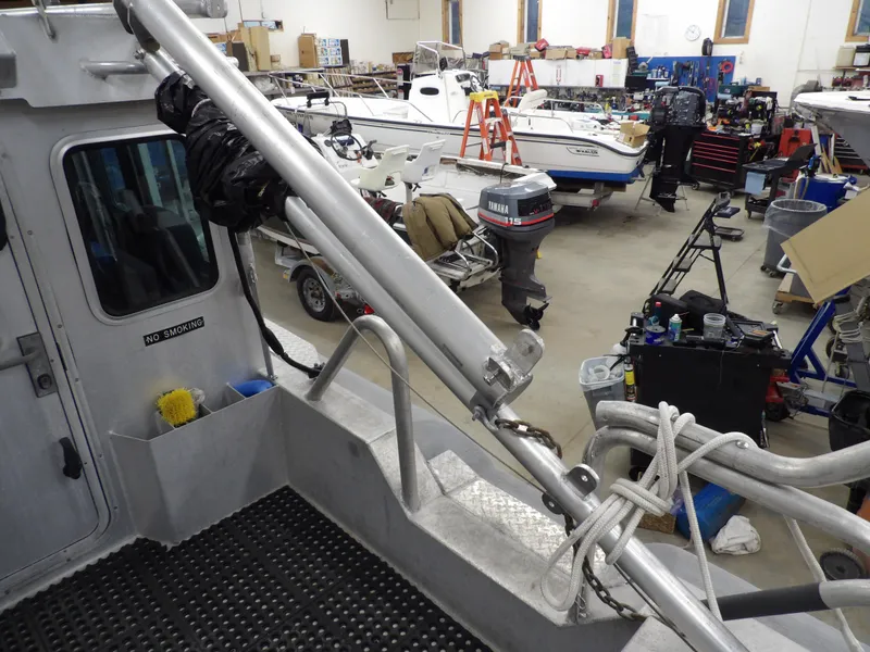 Slide: The Image of Interior view of a 2005 SAFE Boats Defender 25 in a workshop with various equipment. - 45
