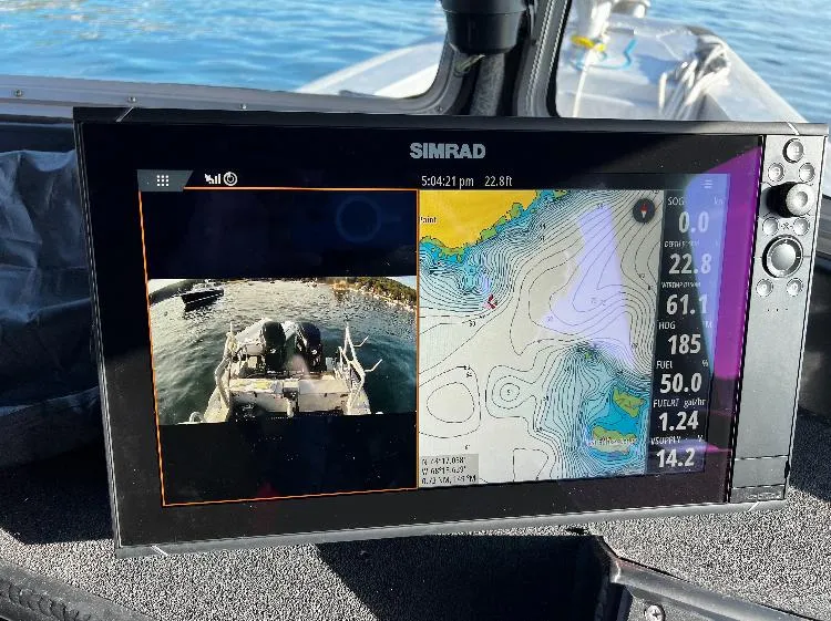 Slide: The Image of Simrad navigation display on 2005 SAFE Boats Defender 25, showing map and camera view. - 5