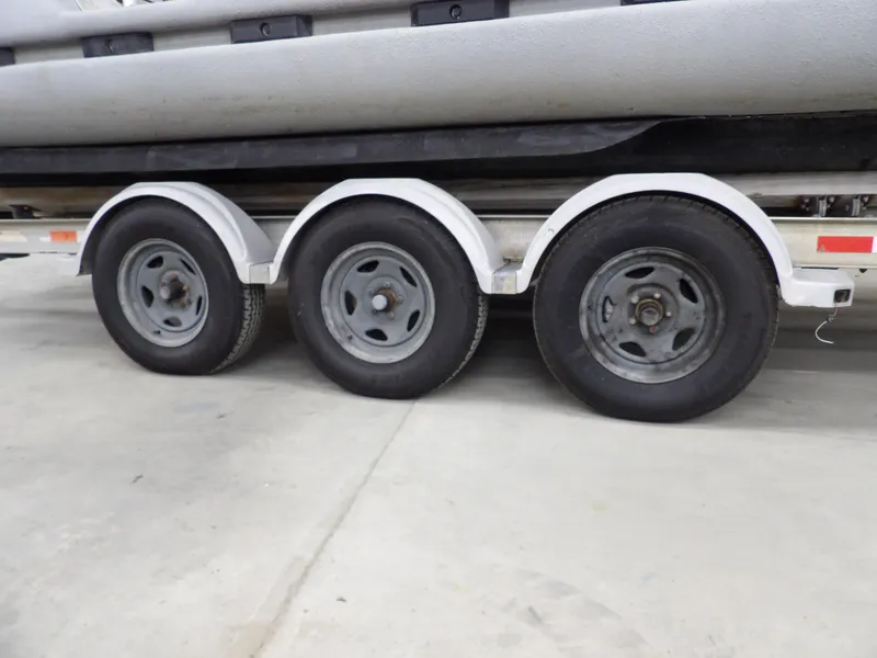 Slide: The Image of Triple-axle trailer for 2005 SAFE Boats Defender 25, close-up view. - 89