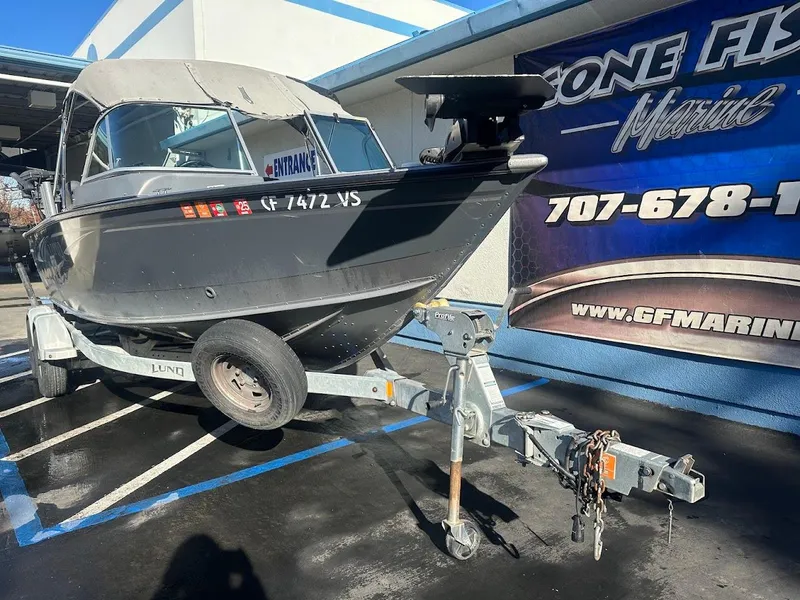 Slide: The Image of 2019 Lund 2000 Sport Angler boat on trailer outside GF Marine dealership. - 11