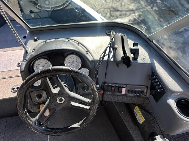 Slide: The Image of 2019 Lund 2000 Sport Angler dashboard with steering wheel and gauges. - 28