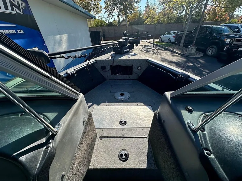 Slide: The Image of 2019 Lund 2000 Sport Angler boat interior with fishing rod holder and storage compartments. - 30