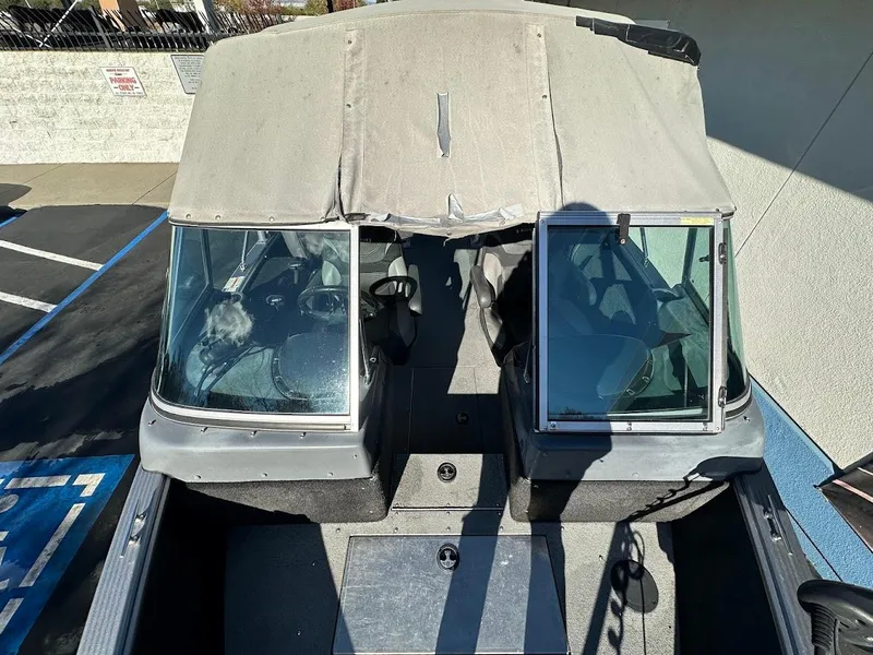 Slide: The Image of 2019 Lund 2000 Sport Angler boat with covered cockpit and dual windshields. - 33