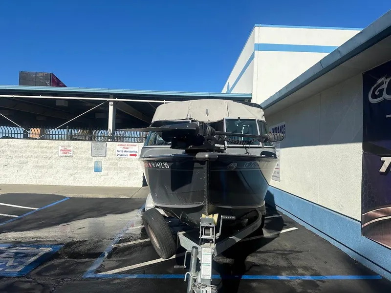 Slide: The Image of 2019 Lund 2000 Sport Angler boat on trailer in parking lot. - 9