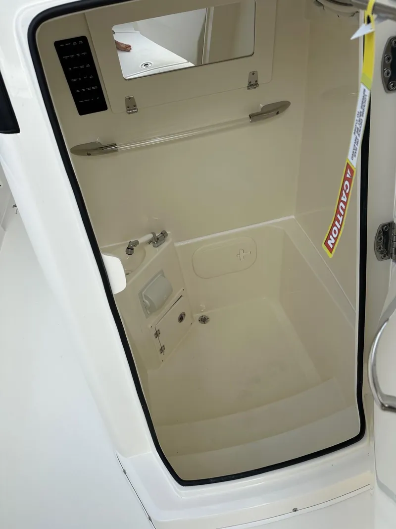 Slide: The Image of 2025 Cobia 240 Center Console interior cabin with modern amenities. - 14