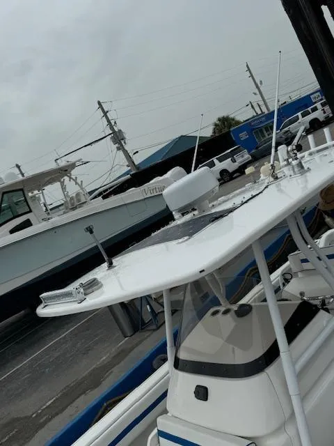 Slide: The Image of 2008 Intrepid Open boat with radar and antennas, docked on a cloudy day. - 3
