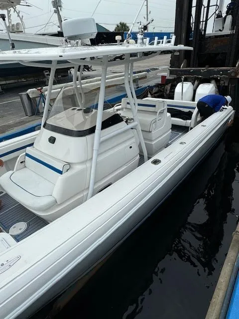 Slide: The Image of 2008 Intrepid Open boat docked, featuring sleek design and spacious seating. - 5