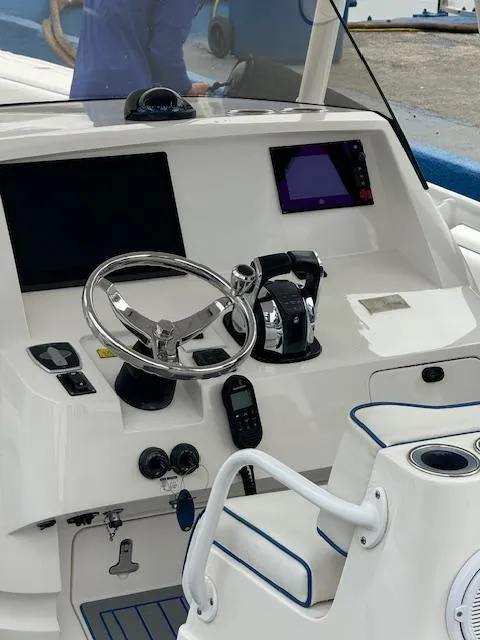 Slide: The Image of 2008 Intrepid Open boat helm with steering wheel and navigation controls. - 7