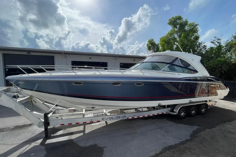 The Image of 2017 Formula 400 Super Sport boat on trailer under cloudy sky. - 0