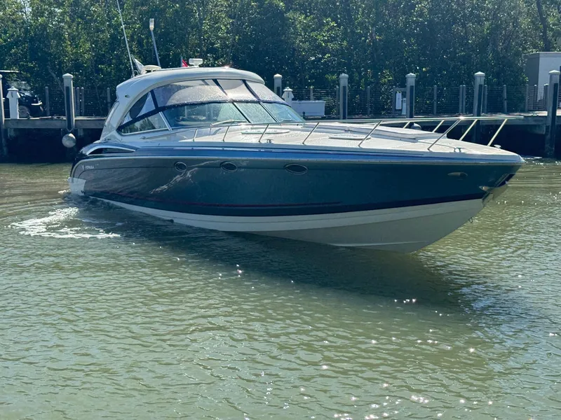 Slide: The Image of 2017 Formula 400 Super Sport boat docked in calm waters. - 11