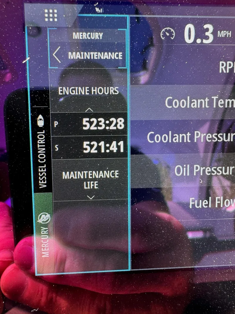 Slide: The Image of 2017 Formula 400 Super Sport engine maintenance display showing engine hours and vessel control. - 14