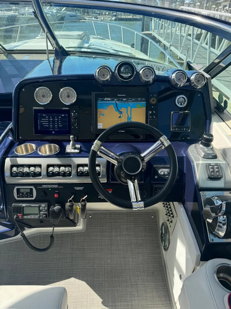 Slide: The Image of 2017 Formula 400 Super Sport boat dashboard with navigation system and controls. - 16
