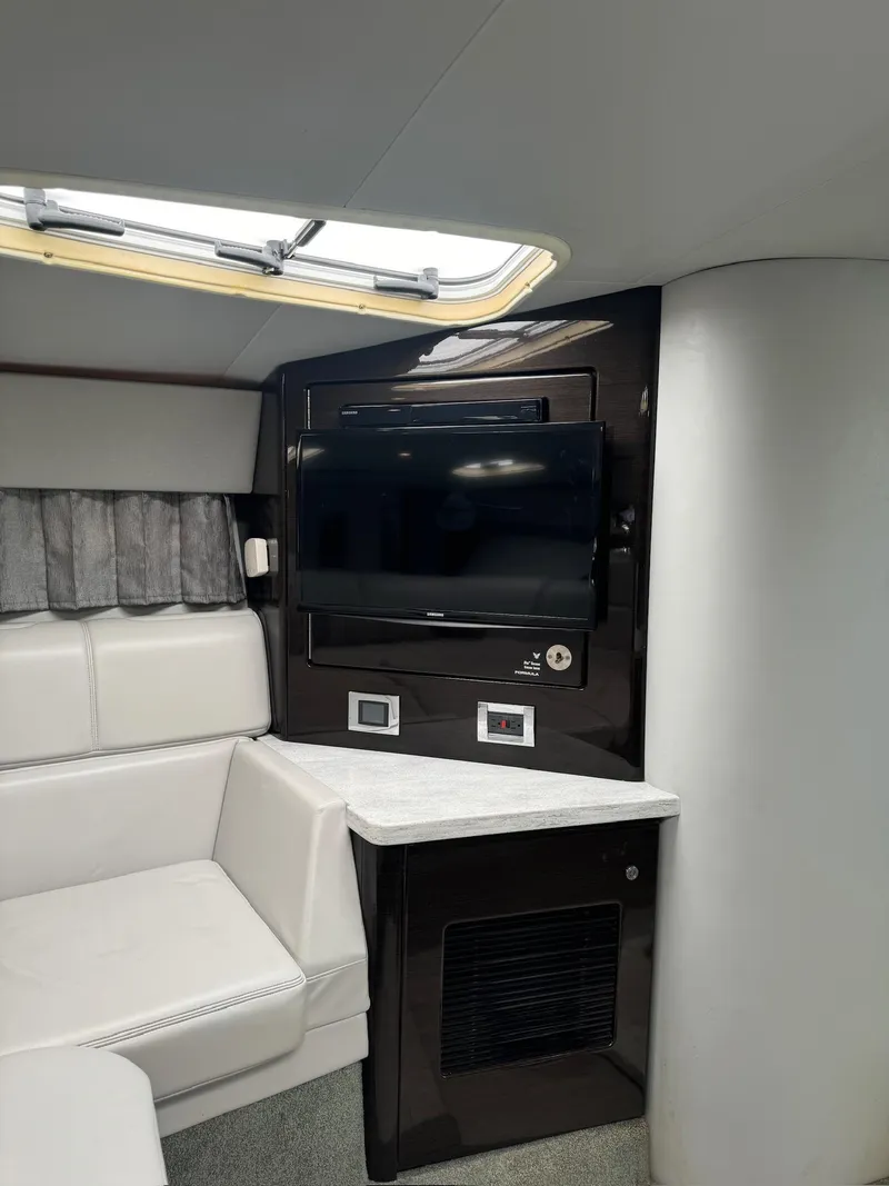 Slide: The Image of Interior of 2017 Formula 400 Super Sport yacht with TV and seating area. - 19