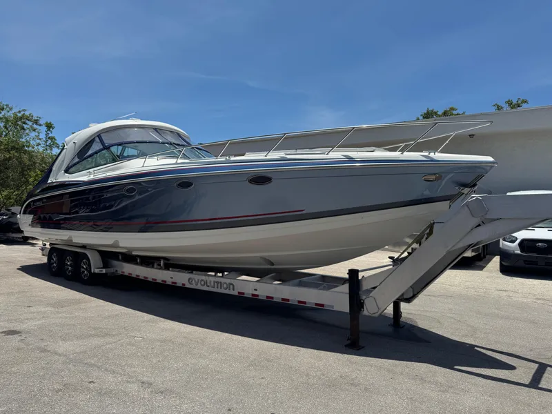 Slide: The Image of 2017 Formula 400 Super Sport boat on trailer under clear blue sky. - 2