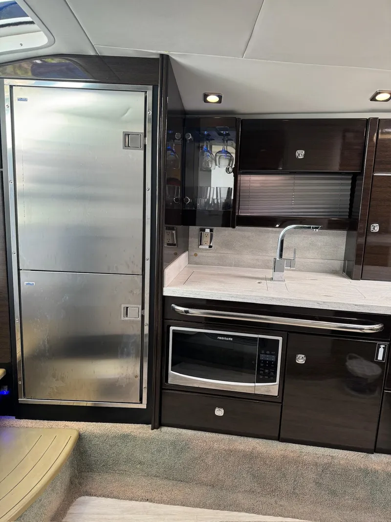 Slide: The Image of Modern kitchen in 2017 Formula 400 Super Sport yacht with stainless steel appliances. - 21