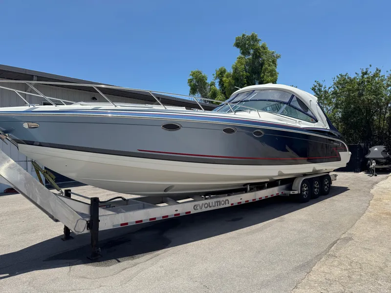 Slide: The Image of 2017 Formula 400 Super Sport boat on trailer, parked outdoors under clear sky. - 3