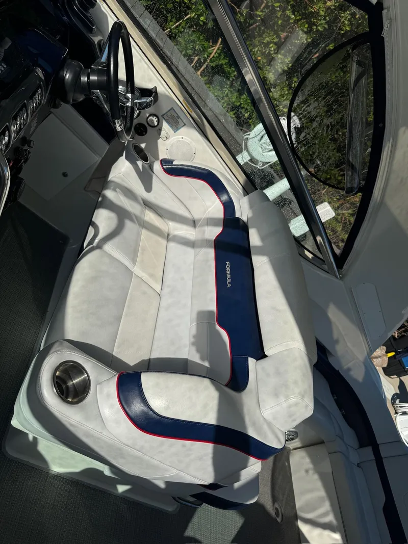 Slide: The Image of 2017 Formula 400 Super Sport boat interior with white and blue seating. - 30
