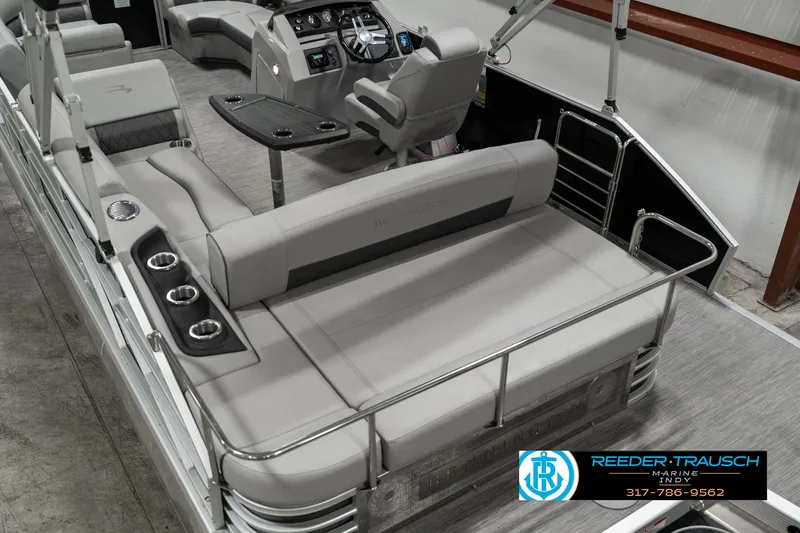 Slide: The Image of 2022 Bennington 22 LSB pontoon boat interior with seating and control panel. - 11