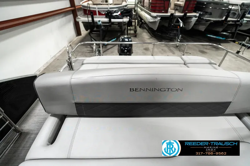 Slide: The Image of 2022 Bennington 22 LSB pontoon boat interior with branded seating in showroom. - 14